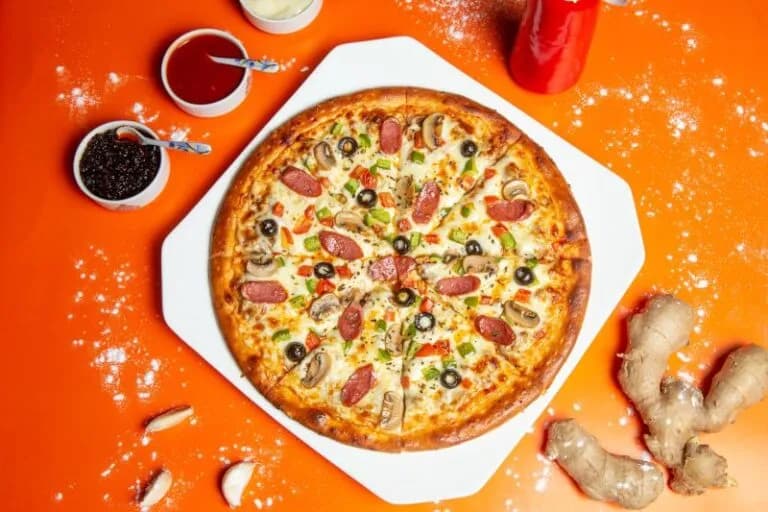 Jak piec pizzę w piekarniku elektrycznym: idealne ustawienia i czasy